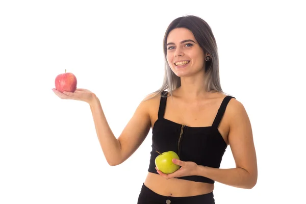 Mulher segurando duas maçãs — Fotografia de Stock