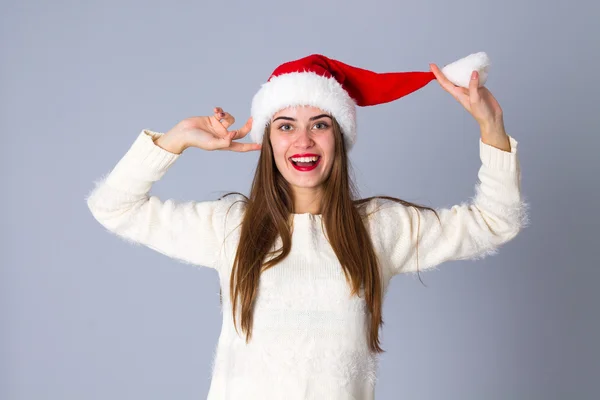 Woman in red christmas hat — Stock Photo, Image