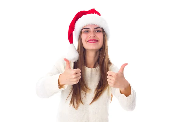 Woman in red christmas hat showing thumbs up — Zdjęcie stockowe