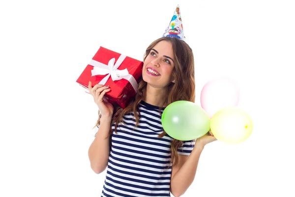 Woman holding present and balloons — Stock Photo, Image