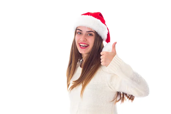 親指に現れる赤いクリスマス帽子の女 — ストック写真