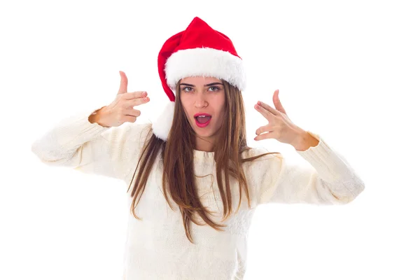 Femme en chapeau de Noël rouge montrant des pistolets — Photo