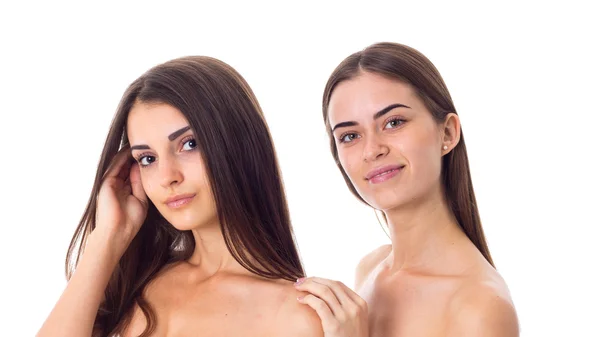 Two young woman with long hair in studio — Stock Photo, Image