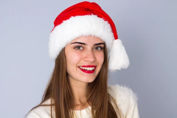 Woman in red christmas hat — Stock Photo, Image