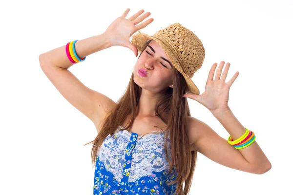 Young woman in hat making faces — Stock Photo, Image