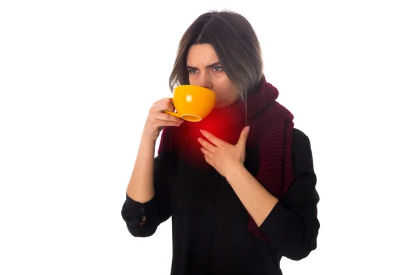 Woman drinking from yellow cup — Stock Photo, Image