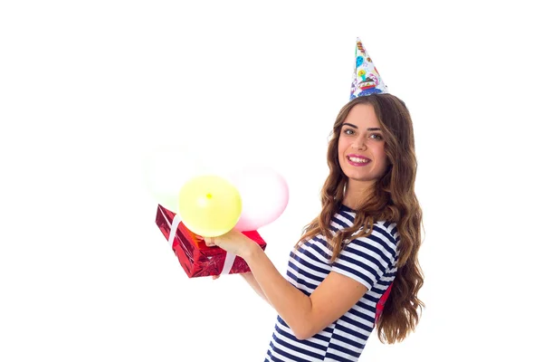 Woman holding present and balloons — Stock Photo, Image