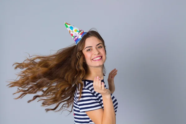 Woman in celebration cap whirling — Stock Photo, Image