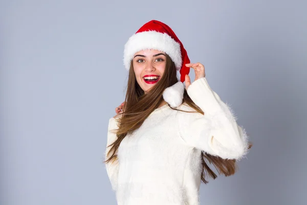 Woman in red christmas hat — Stock Photo, Image