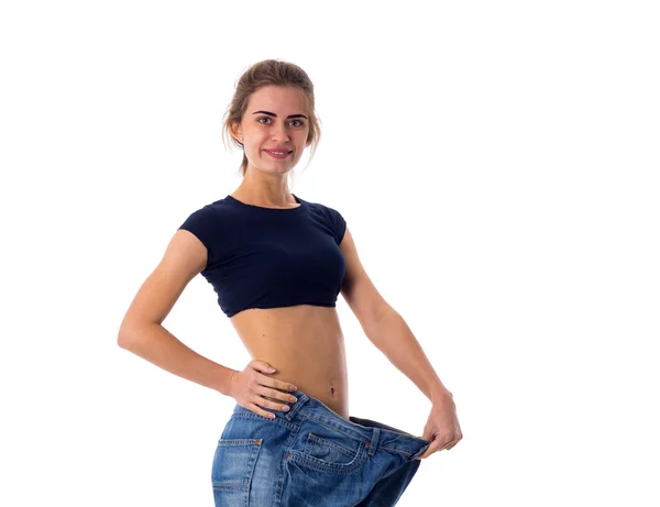 Mujer que usa jeans de tamaño mucho más grande — Foto de Stock