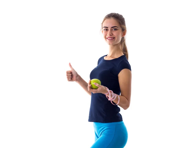 Femme avec centimètre tenant une pomme et montrant pouce vers le haut — Photo