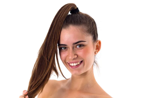Smiling woman with long ponytail — Stock fotografie