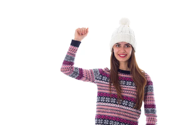 Woman in sweater and white hat showing fist — Stock Photo, Image