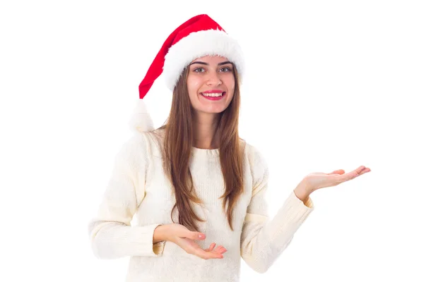 Woman in red christmas hat holding something — Stock Photo, Image