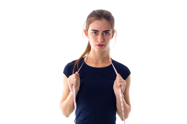 Young woman holding centimeter around her neck — Stock Photo, Image