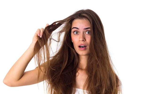 Woman touching her tangled hair — Stock Photo, Image