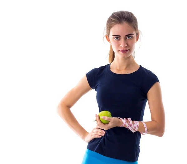 Femme avec centimètre tenant une pomme — Photo