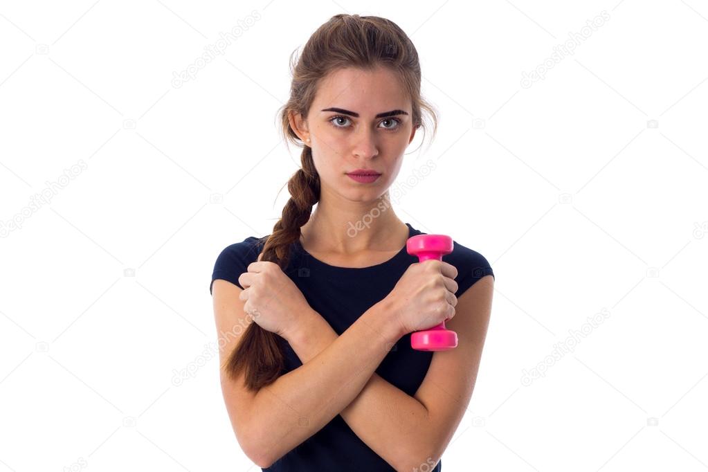 Woman holding a pink dumbbell