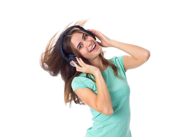 Jovem mulher em fones de ouvido — Fotografia de Stock