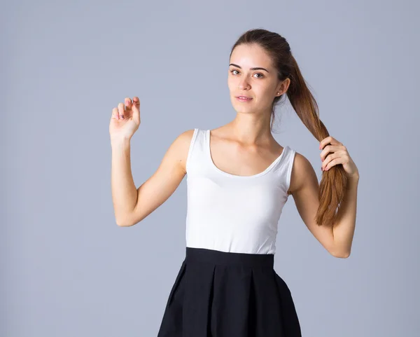 Young woman in white shirt and black skirt — Φωτογραφία Αρχείου