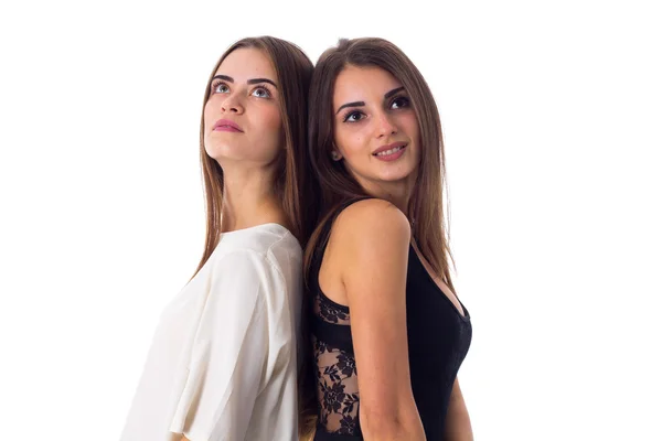 Two young woman standing back to back — Stock Photo, Image