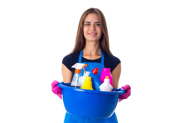 Mulher segurando coisas de limpeza em lavatório — Fotografia de Stock