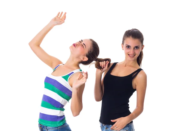 Young woman holding another womans hair — ストック写真