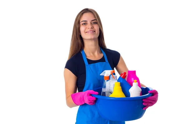 Mulher segurando coisas de limpeza em lavatório — Fotografia de Stock