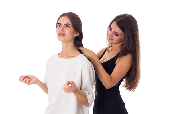 One woman making another one a plait — Stock Photo, Image