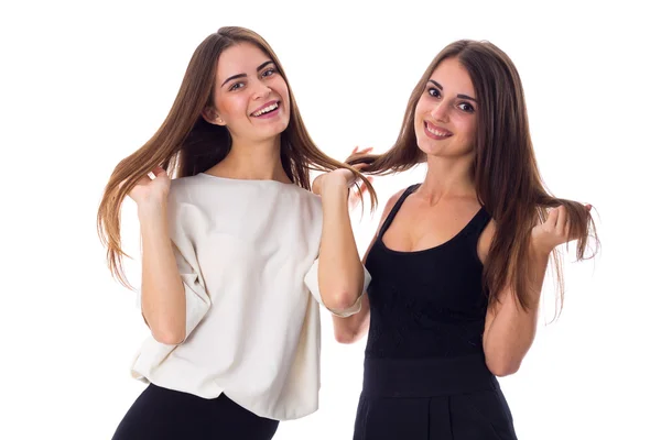 Two young woman touching hair — Stock Photo, Image