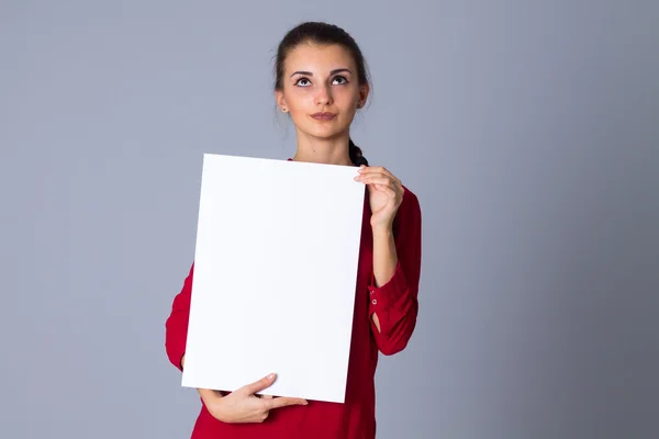 Woman holding white sheet of paper — Stock Photo, Image
