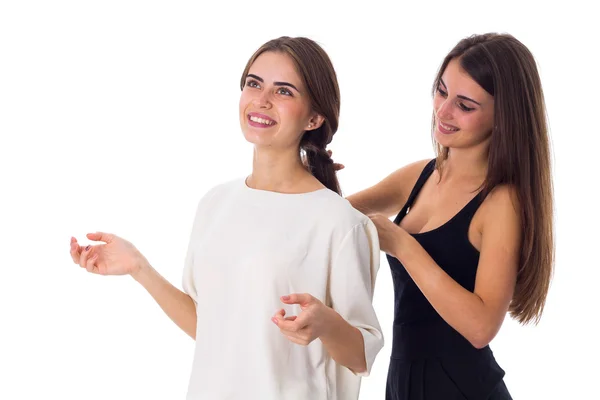 One woman making another one a plait — Stock Photo, Image