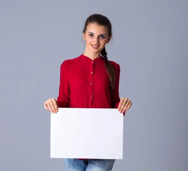 Woman holding white sheet of paper — Stock Photo, Image