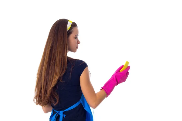 Woman using detergent and duster — Stock Photo, Image