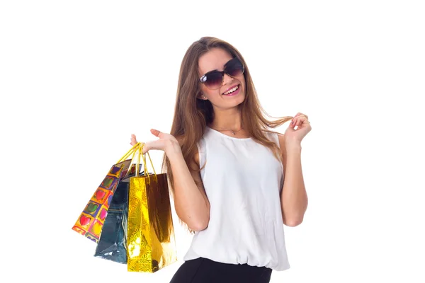 Mujer en gafas de sol con bolsas de compras —  Fotos de Stock