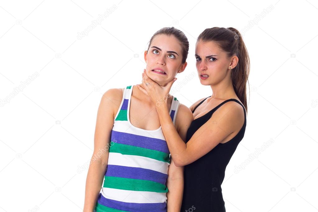 Young woman keeping another womans throat