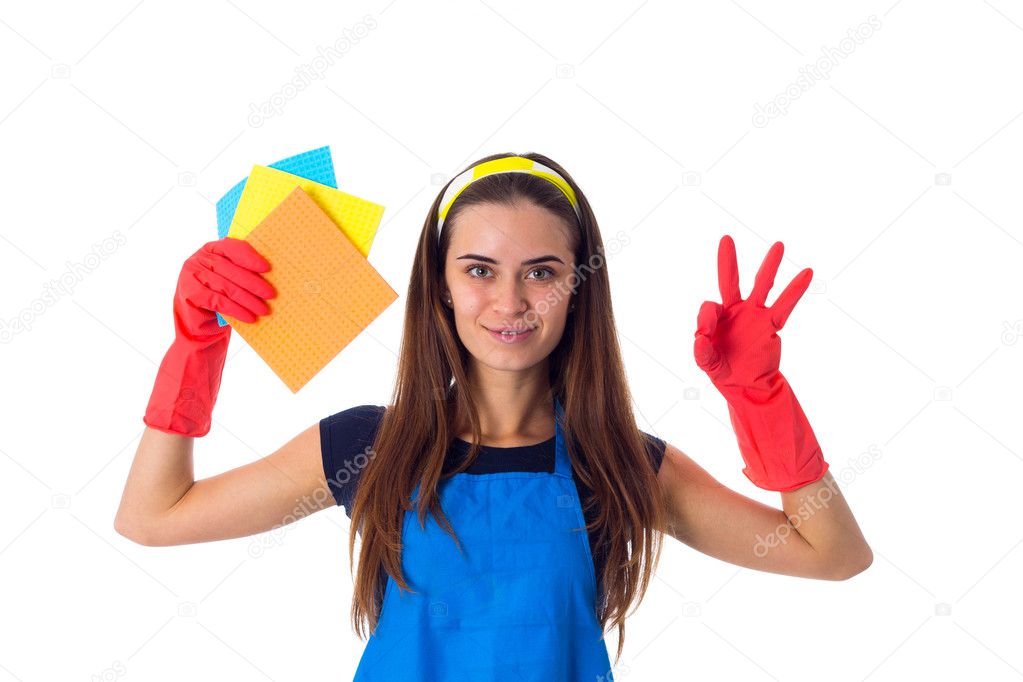 Woman in apron holding dusters