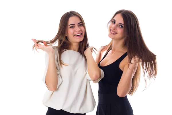 Two young woman touching hair Stock Image