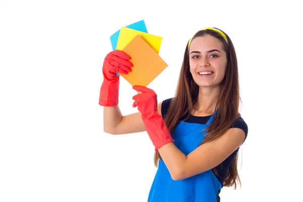 Frau in Schürze hält Staubwedel — Stockfoto