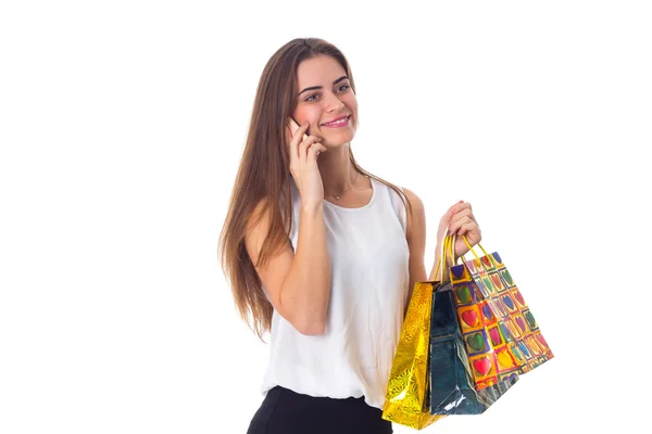 Nő a smartphone és a bevásárló szatyrok — Stock Fotó
