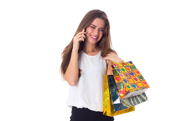 Mulher com smartphone e sacos de compras — Fotografia de Stock