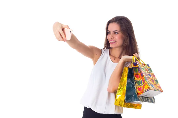 Woman with shopping bags making selfie — Stock Photo, Image