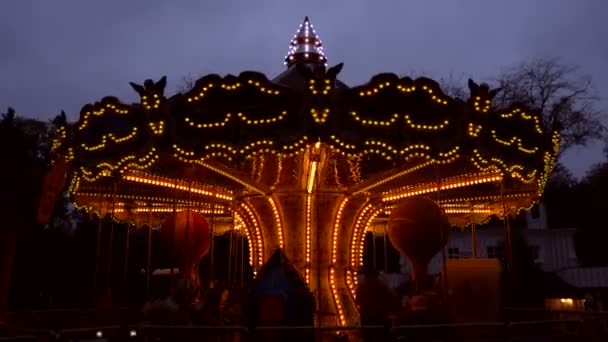 Illuminated retro carousel at night — Stock Video