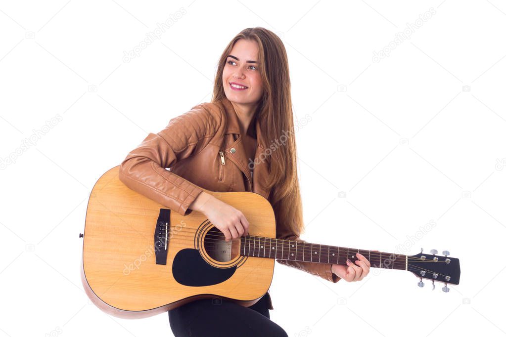 Young woman holding a guitar