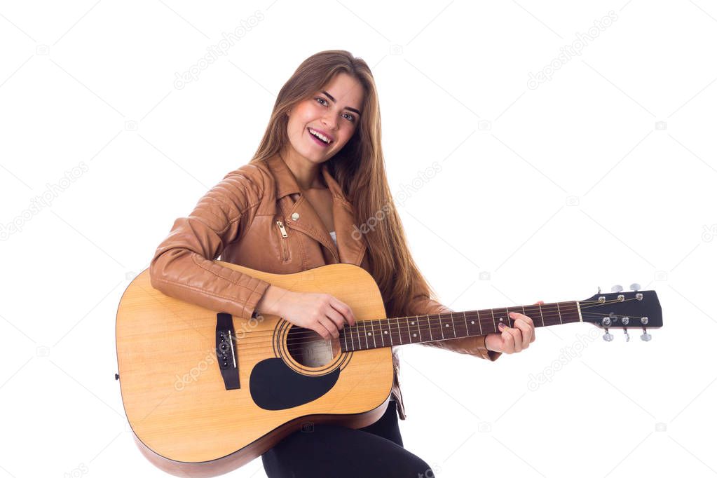 Young woman holding a guitar