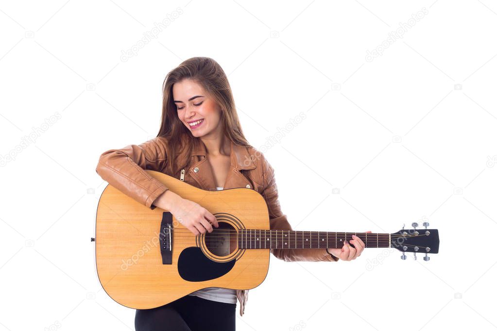 Young woman holding a guitar