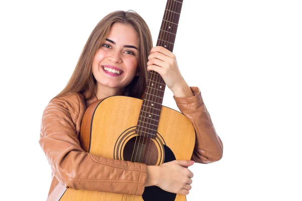 Young woman holding a guitar — Stock Photo, Image