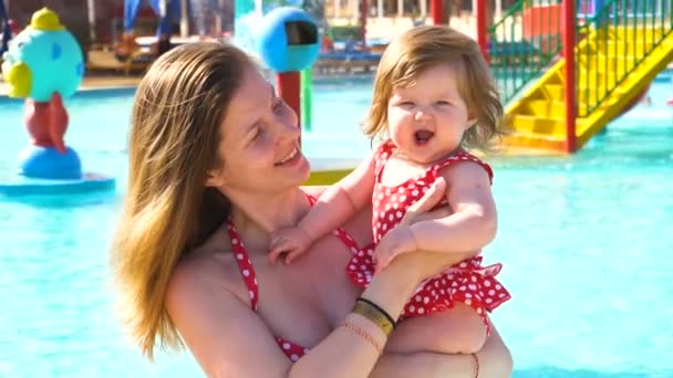 Happy mother holding her baby girl in hands — Stock Video