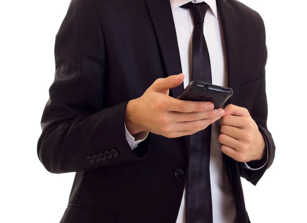 Un joven de traje hablando por teléfono. —  Fotos de Stock