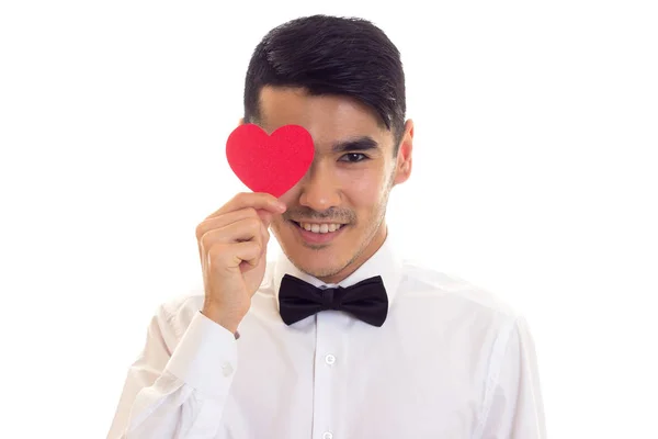 Joven sosteniendo un corazón leído — Foto de Stock